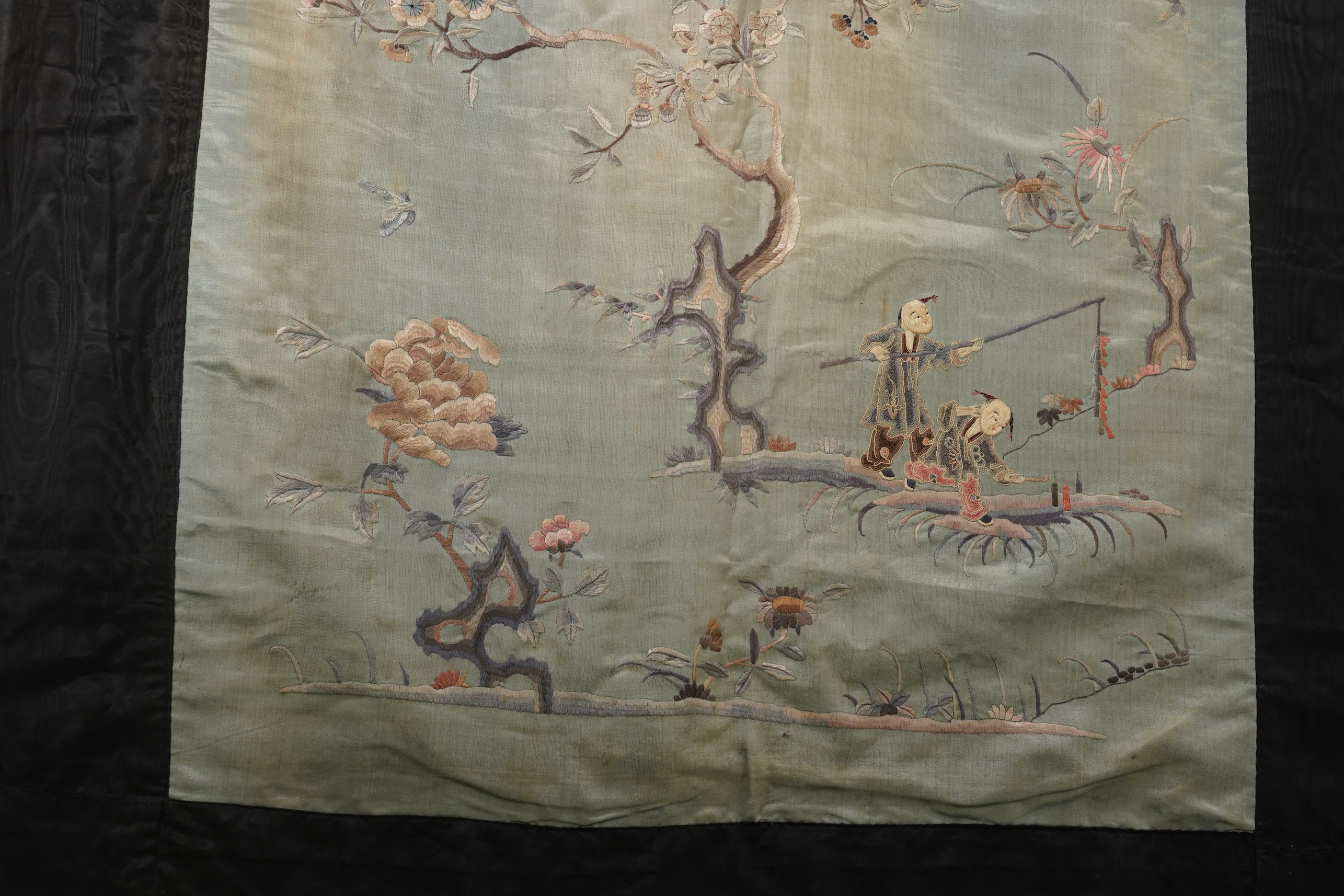 A Chinese embroidered silk ‘dragon dance’ panel, 18th/19th century